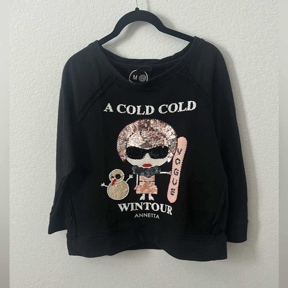 MUA MUA
black sweatshirt with a cartoon-style graphic